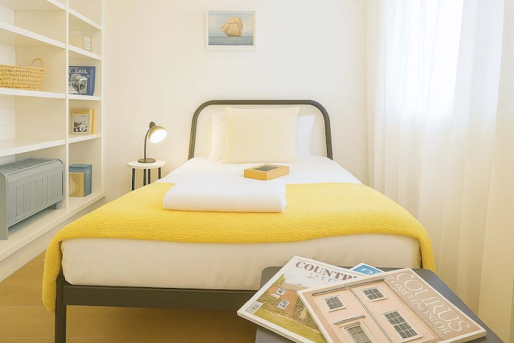 Single bed with panel heater.