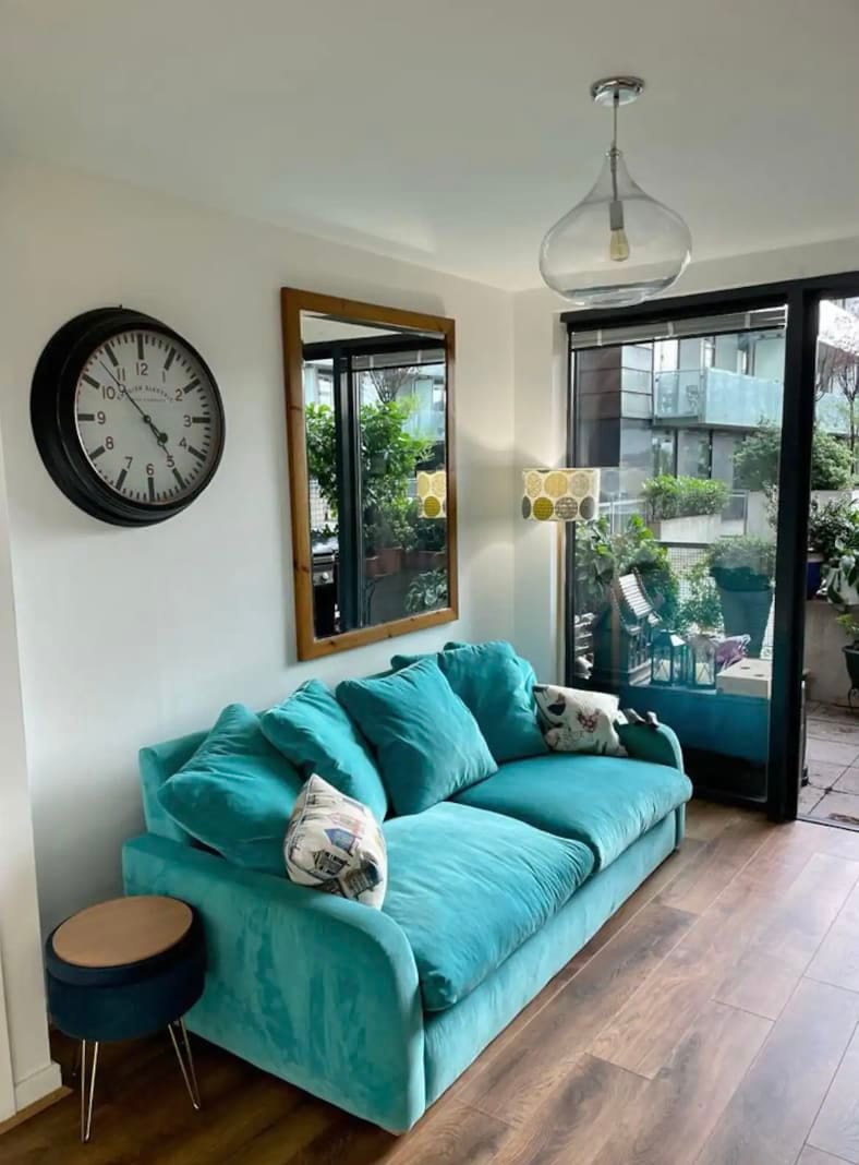 Large ultra comfy 3 Seater Loaf Sofa with ottoman with views out onto terrace and the river.