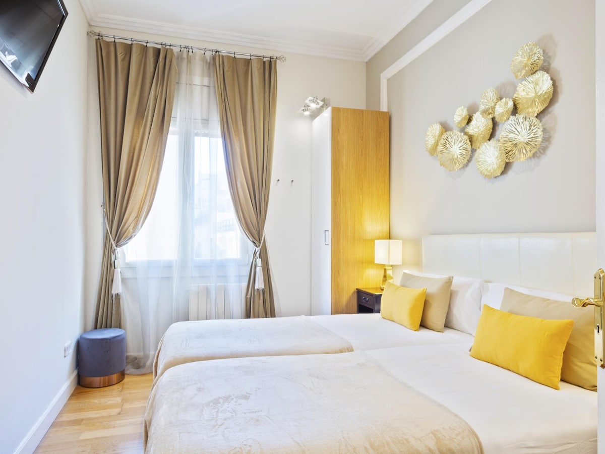 Bedroom 5: Located on the Main Floor, this bright room is next to the living room, kitchen, and pool area. It features a wardrobe with safe, TV, and two beds that can be arranged as a double bed or as two singles upon request.