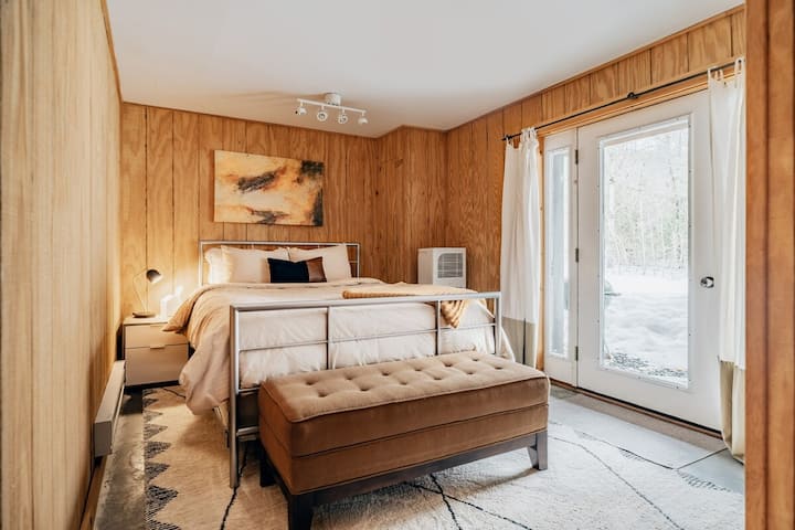 The third bedroom (queen), which is located on our basement level and opens up to our backyard fire pit area.