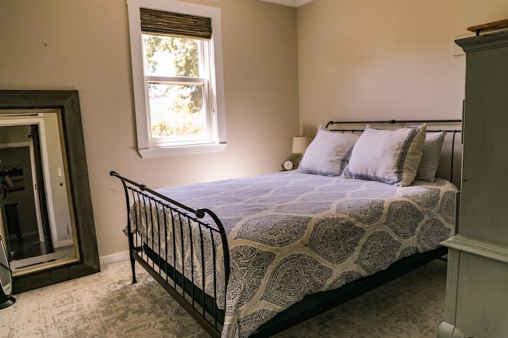 The first bedroom has a queen-sized bed. 