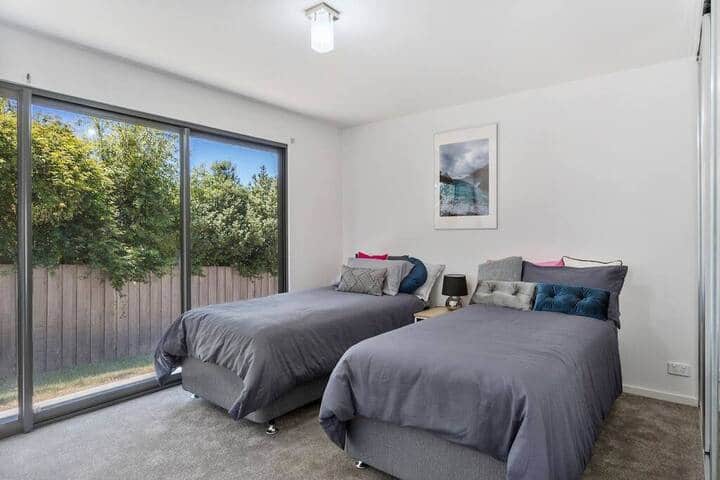 Two single beds with built-ins and Television