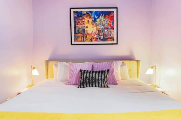 Private bedroom number 2 featuring a king bed and plush linens