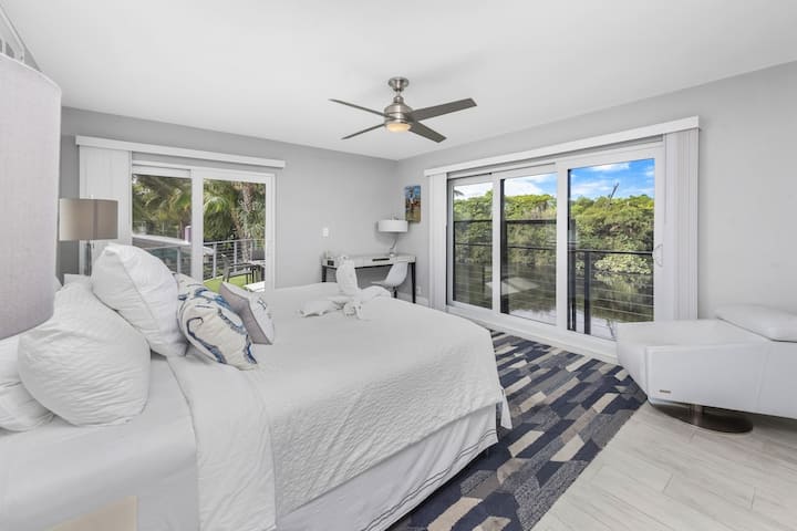 Primary bedroom takes full advantage of the best views on the property