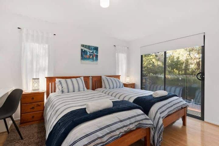 Bedroom five with two single beds