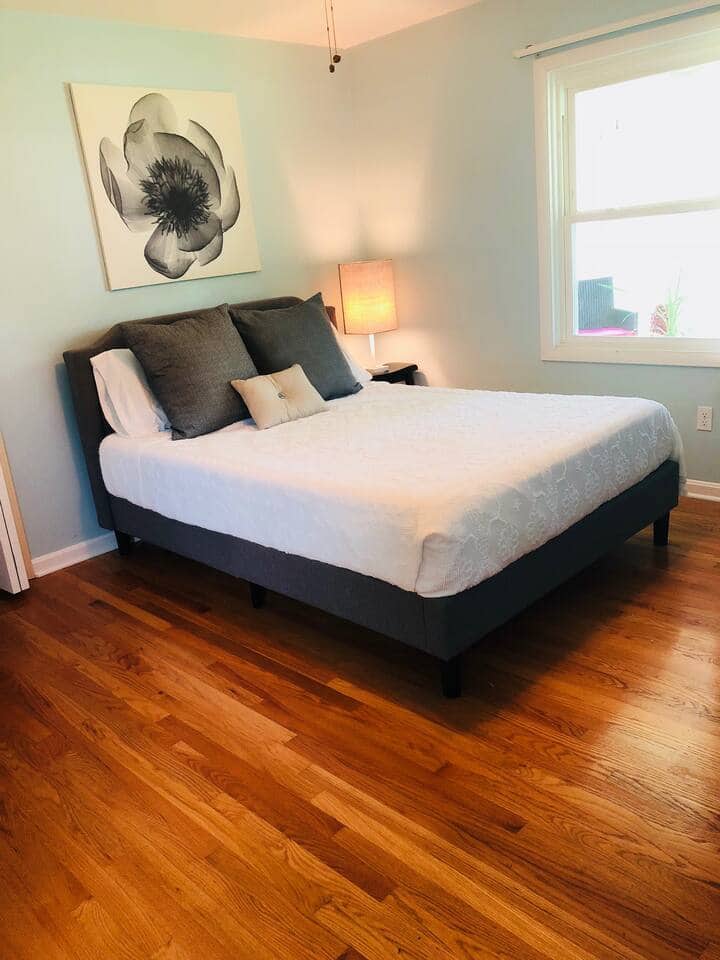 This room has a queen size bed with TV, closet with hangers and two luggage racks, plus a pocket door to the laundry room with stacked washer and dryer. 