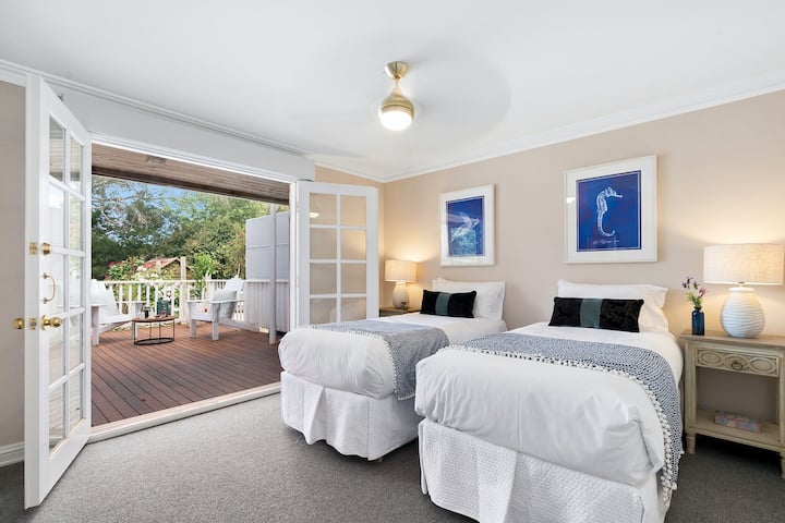 Twin room is great for two friends, the kids or ask for beds to be morphed as a king bed (extra charge may apply) .... french doors open onto large deck. We call this one, the Merlot Room. 