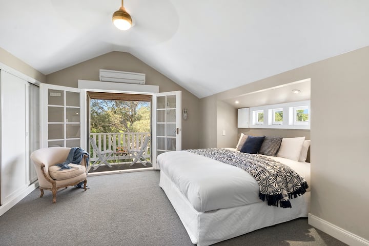 Relax whilst enjoying forest views...  We call this one the Champagne Room.  Whilst the bed may be split into 2 at extra cost, the advertised rate is based on a king bed configuration. 