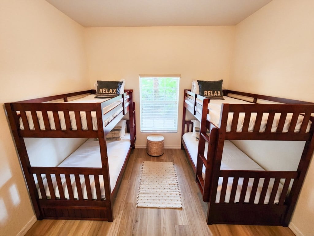 - Kids bunk bedroom with twin beds fun setup and bright welcoming space
- Perfect for families traveling with children comfort safety and space
- Family friendly sleeping area designed for group vacation stays  