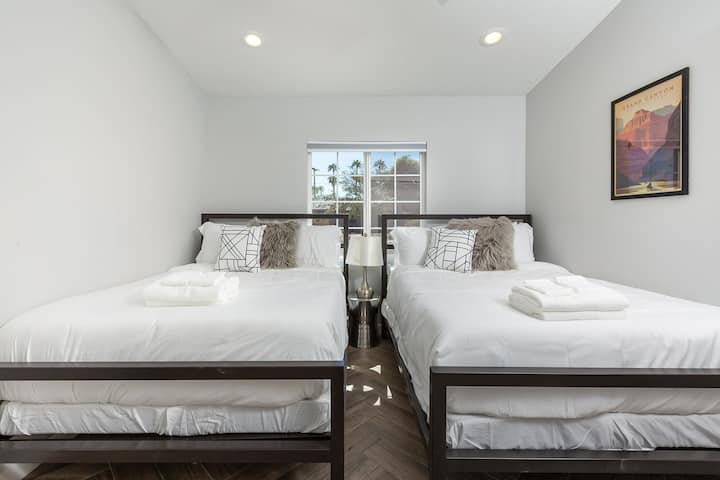 Cozy and spacious, the 5th bedroom features two full-size beds for a restful night’s sleep.