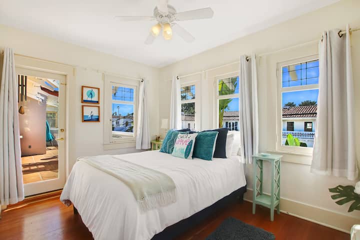 Upstairs guest bedroom with queen bed and 1/2 bath on-suite and A/C.