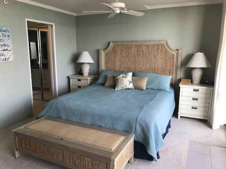 Main bedroom with southern ocean view and king bed