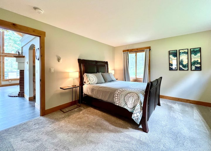 Main floor bedroom with queen bed and ensuite bathroom