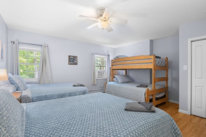 Lower level "bunkroom".  2 Queen beds with twin over full bunk bed.  Smart TV.