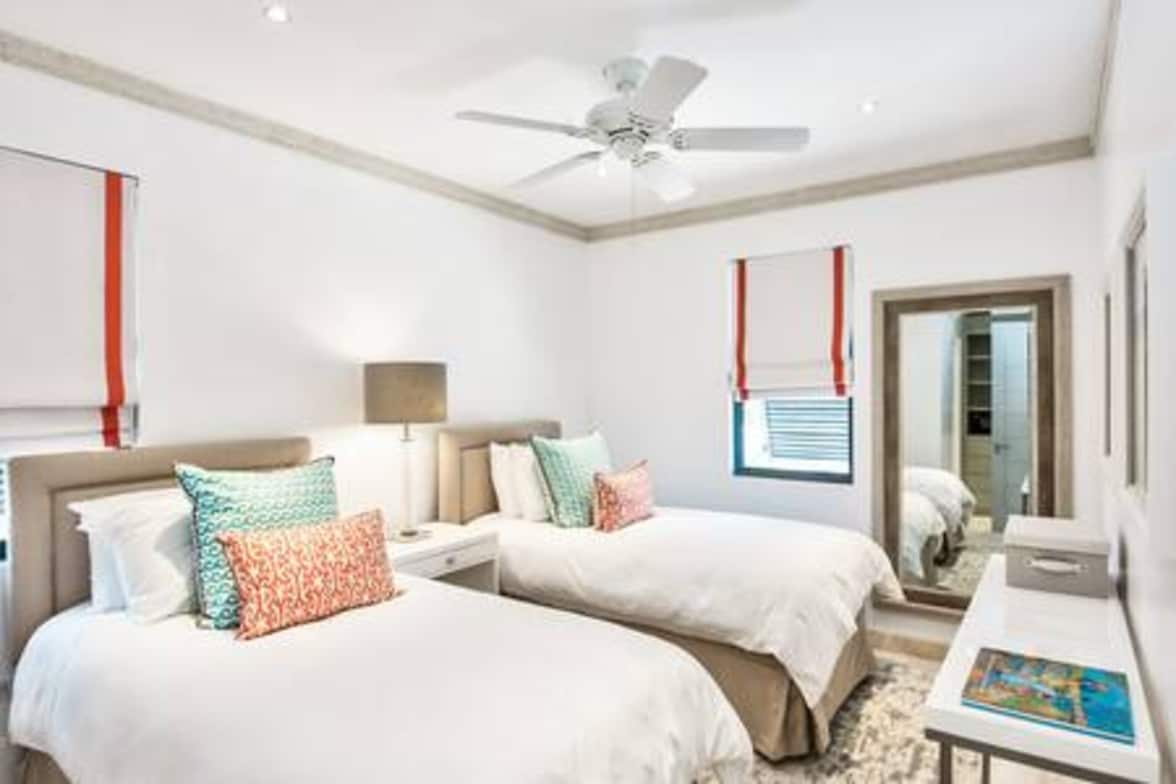 Bedroom 5 with a king size bed (US) or twin bed configuration, ensuite shower room, security safe, air conditioning, bath robes, hair dryer.