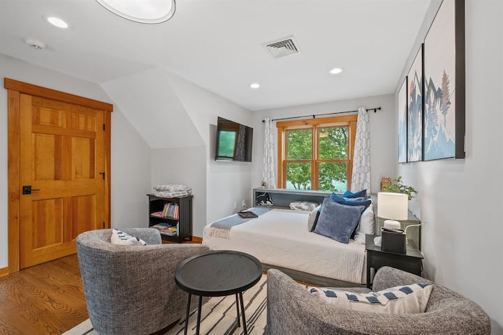 Second floor loft bedroom with queen bed and bath just outside the door