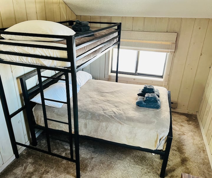 Upstairs front bedroom: full bed with twin loft with desk work area