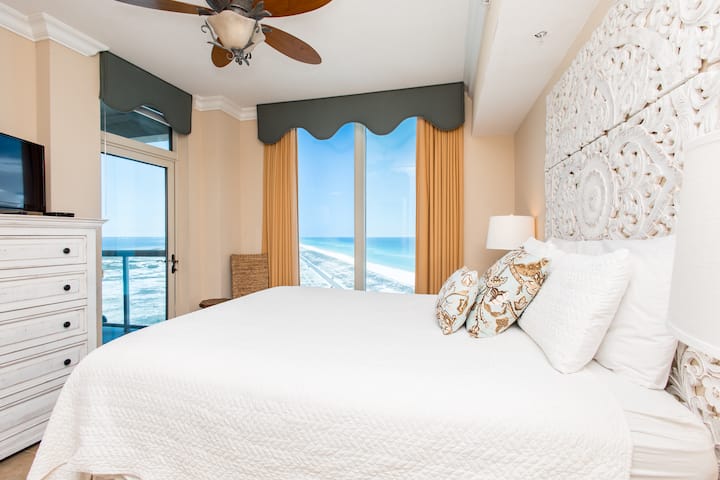 Wake up to sparkling waves right outside your window—the beachfront view from this serene bedroom will make every morning unforgettable.