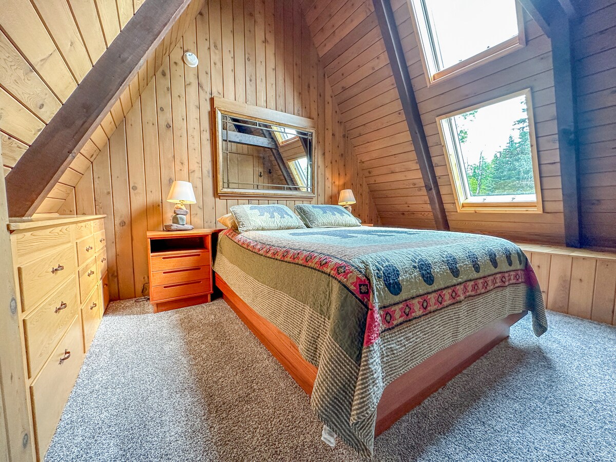 The third bedroom, located off the living room loft, has a queen bed.