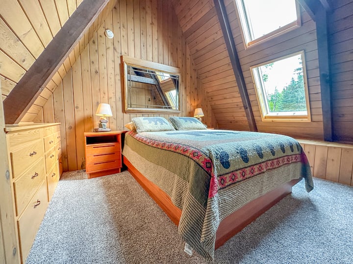 The third bedroom, located off the living room loft, has a queen bed.