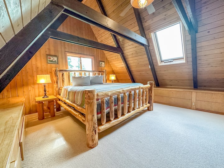 The second bedroom, located above the kitchen, also has a custom king sized bed.