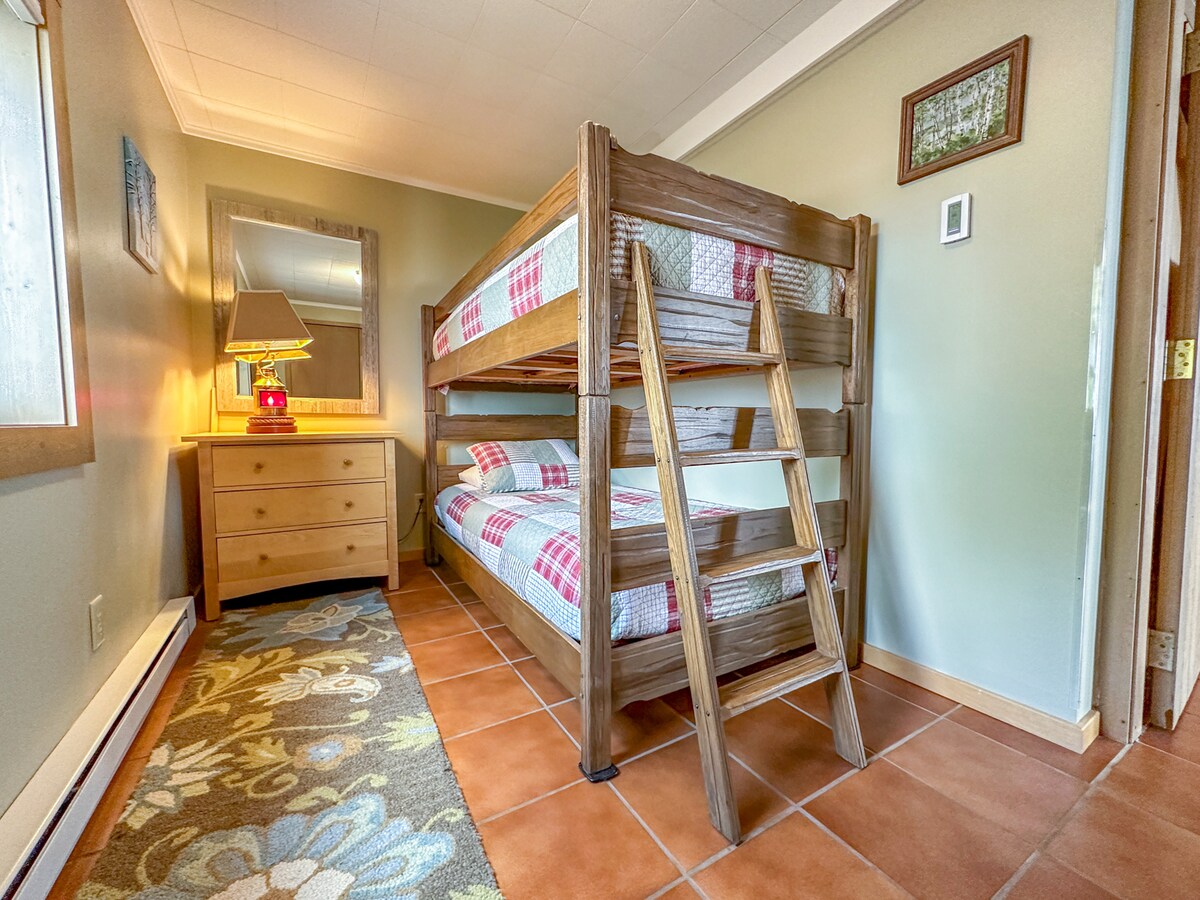 The fourth bedroom, this one located on the lower level has twin over twin bunk beds.
