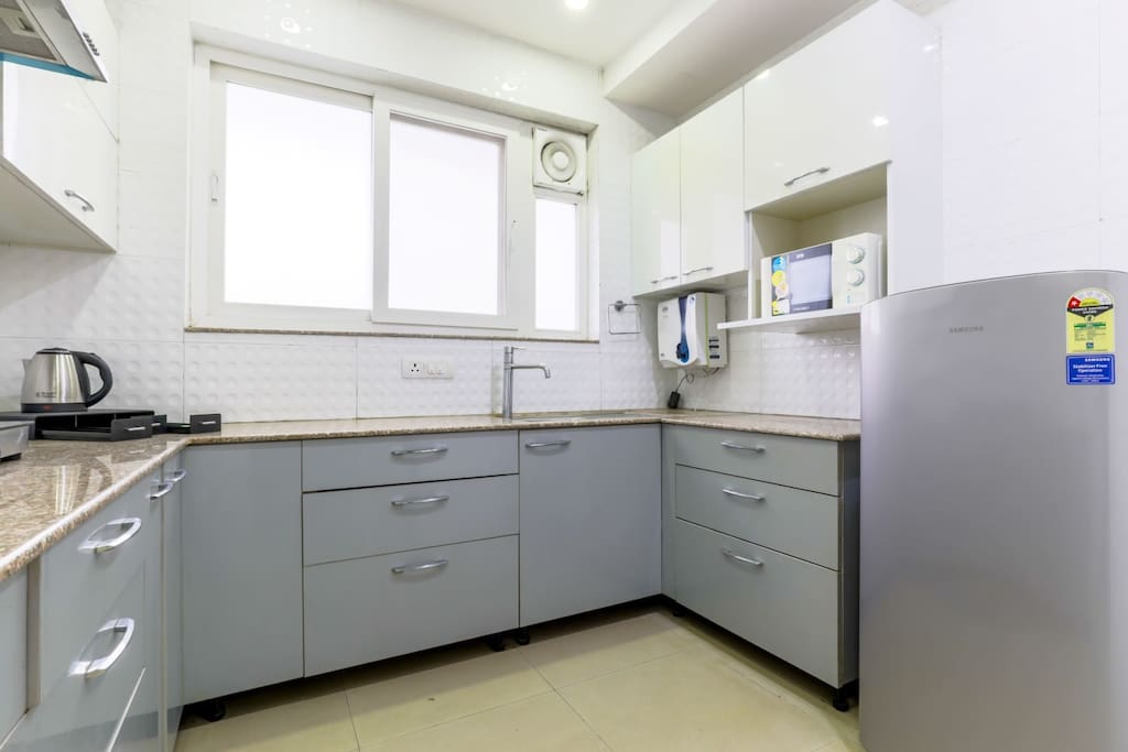 Our kitchen is fully equipped with all amenities i.e. Coffee maker(Espresso and Cappuccino 4-Cup Coffee Maker), toaster,  mixer grinder, rice cooker, gas, Microwave, refrigerator, cooking and serving utensils, etc.
