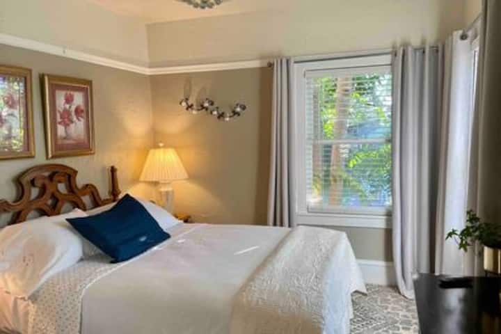 Plush queen sized bed,  blackout curtains and desk