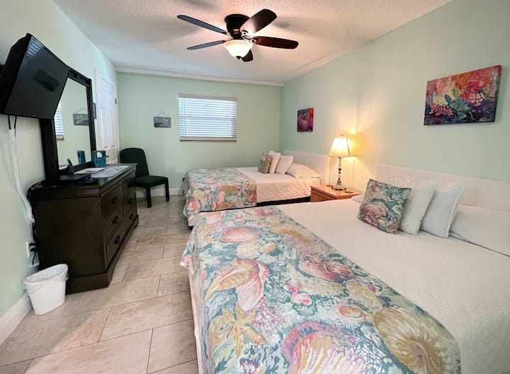 Third Bedroom With Two Queen Sized Beds, TV, and Attached Bathro