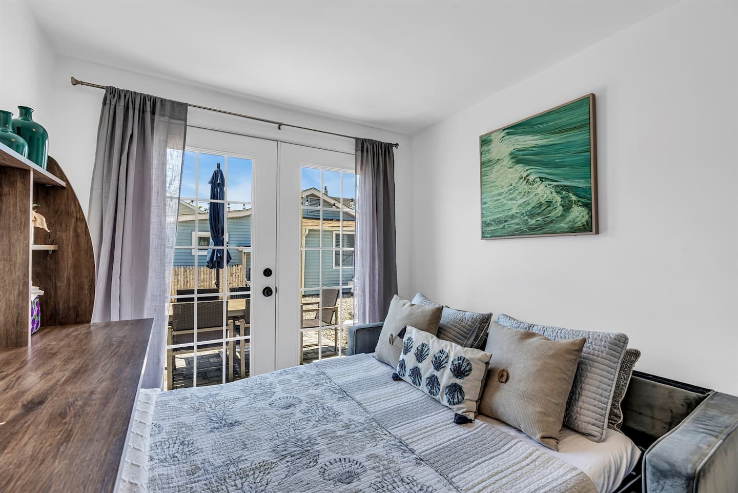 Cozy sunlit lounge with ocean-inspired art