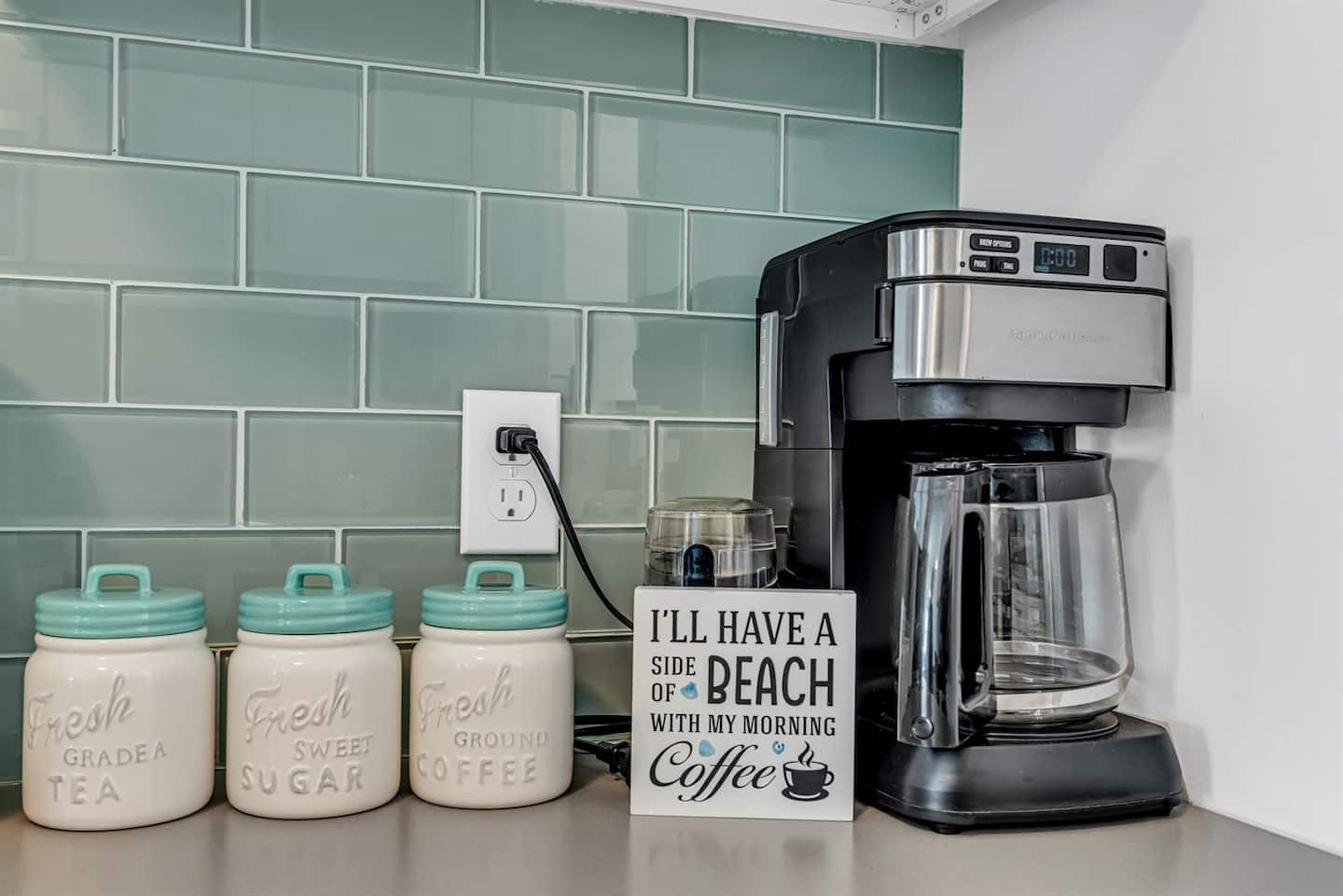 Wake up to fresh coffee and coastal vibes in this bright breakfast corner