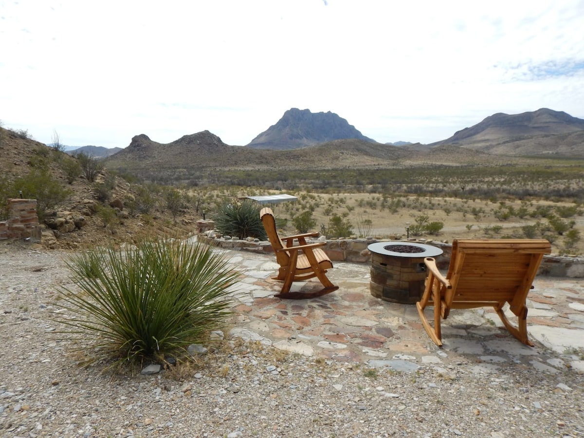 Photo of an outdoor seating area with mountain views of the Texas high desert.