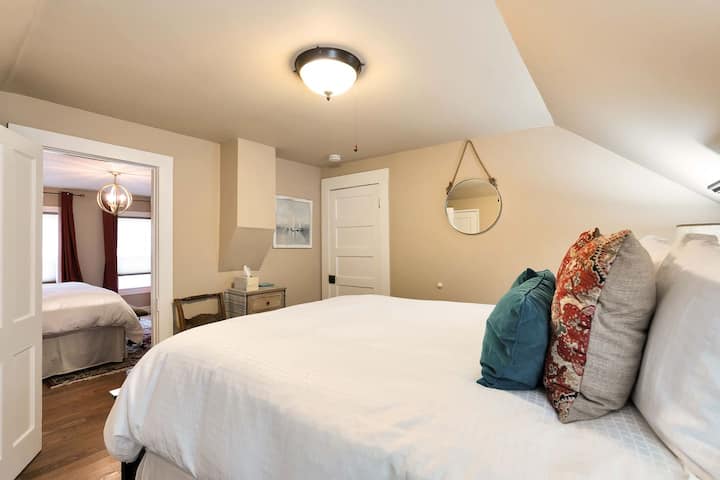 Private Guest room with queen size mattress, adjoining the Master Suite. Includes a locking door for privacy and a separate hallway exit leading directly to the 2nd-floor bathroom.