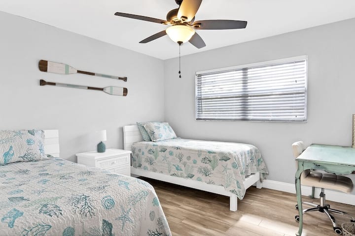 The third bedroom has 2 twin sized beds for those traveling with kids or for larger parties.  We have also included a desk and chair for remote learning or an extra remote work space.