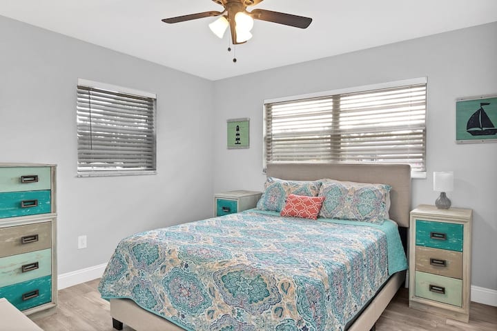 The second bedroom is bright and cheerful and includes a queen sized bed for our guests.