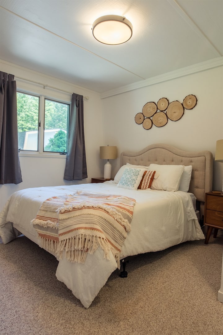 The first floor has a guest bedroom with a queen bed.