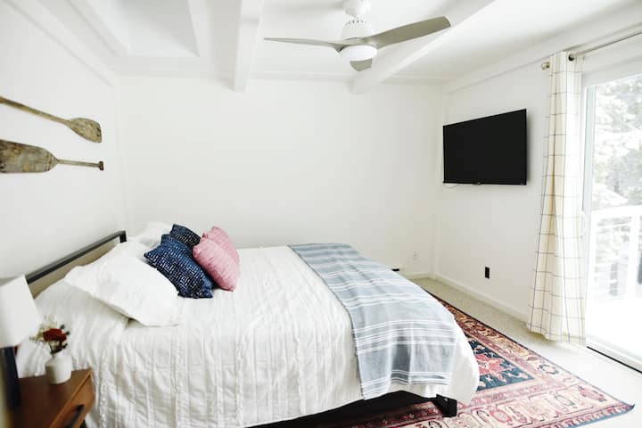 Bedroom #3: the master suite with an ensuite private bathroom and private balcony as well as a skylight and smart tv.