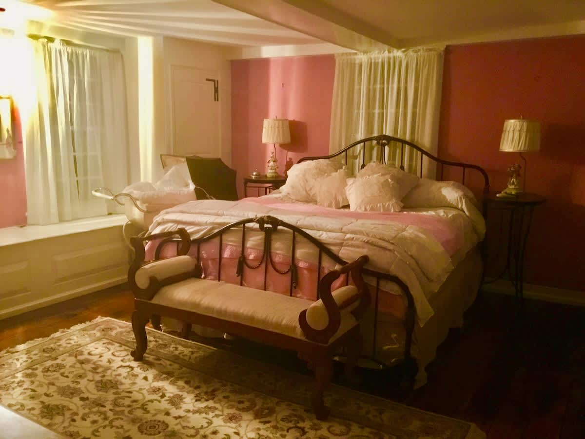 The "Pink room" in the two-bedroom suite also has a working fireplace for those chilly winter nights