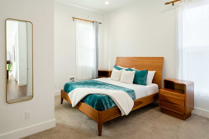 Bedroom 3 with queen bed and dresser.