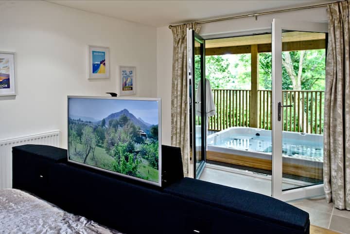 TV in the master bedroom - Cedar Lodge