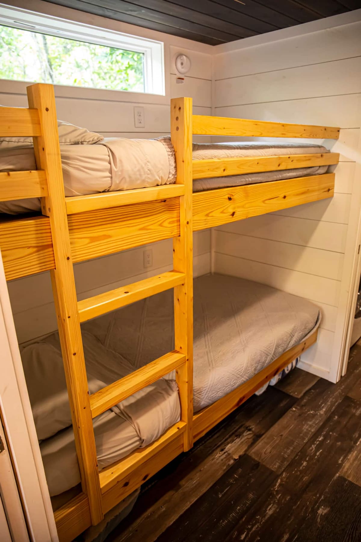 You’ll find two twin bunk beds in the hallway just before the master bedroom.