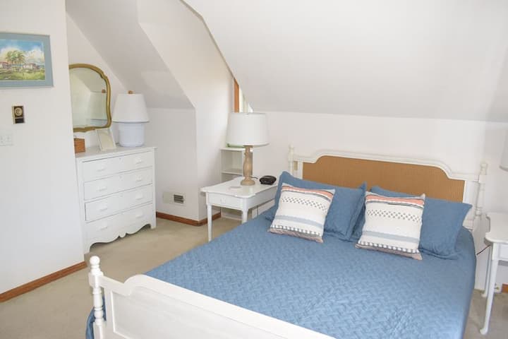 2nd Floor Bedroom with one queen and one twin, and a private balcony.