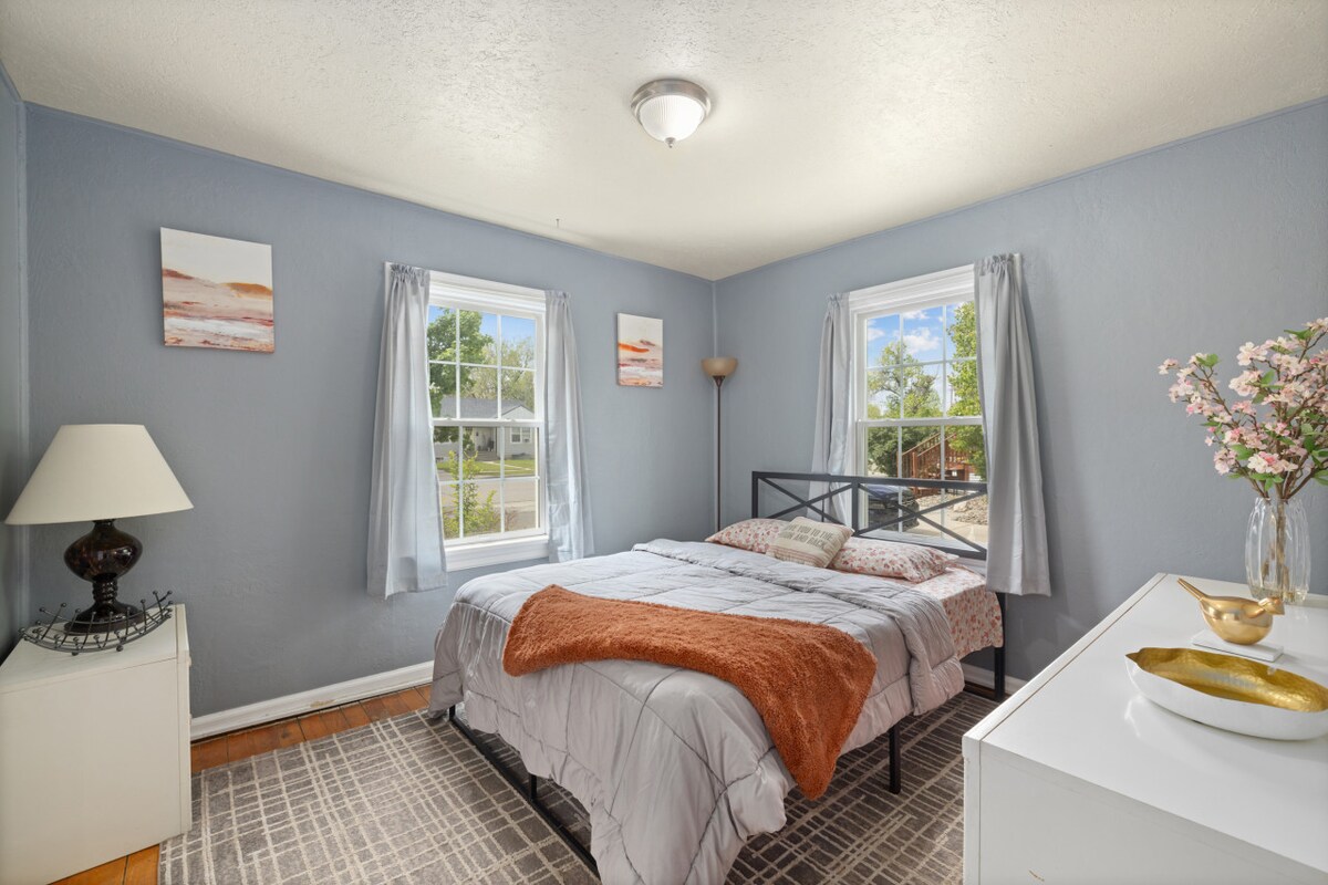 One of two queen beds on main floor