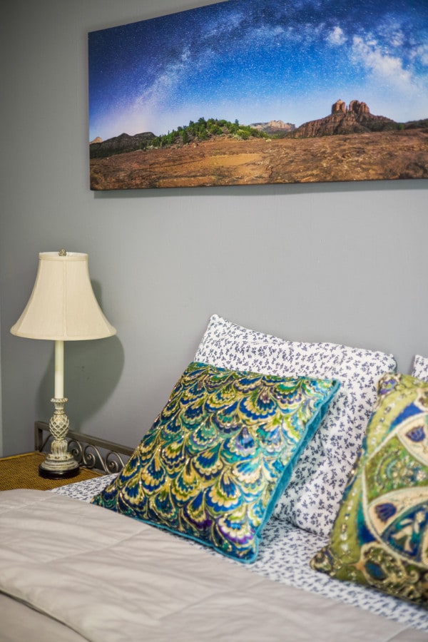 One of two queen beds on main floor