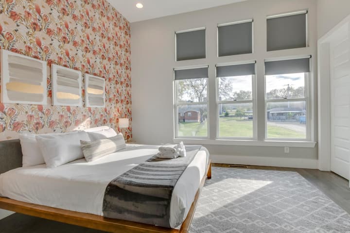 Bedroom with a view of the outdoors.