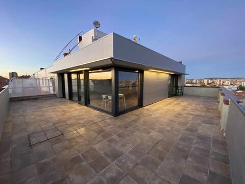 Modern loft with panoramic views.