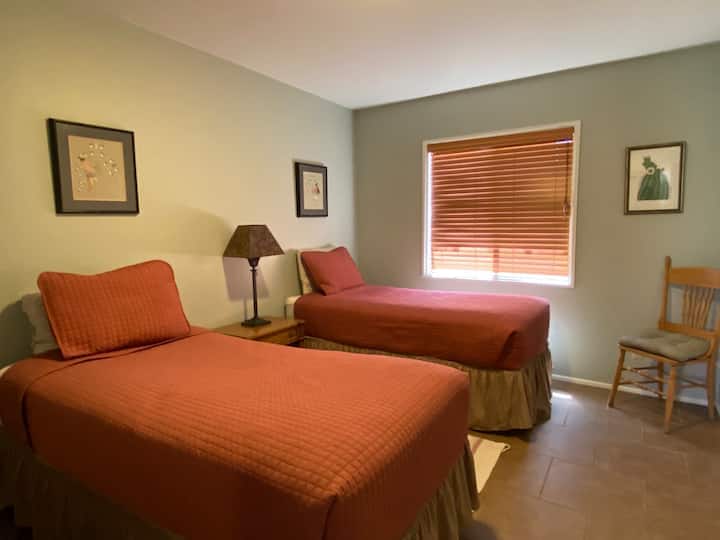Second room on the ground floor - two Twin beds with full dresser/mirror, side table and closet.