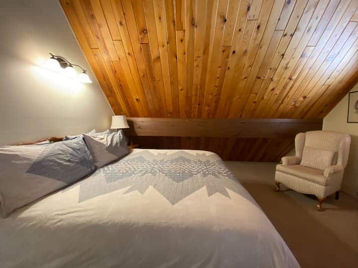 Primary King bedroom upstairs with en suite bathroom.  Window and full bureau and closet space.