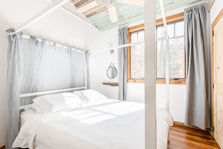 Second bedroom on primary floor with easy access to hall bath