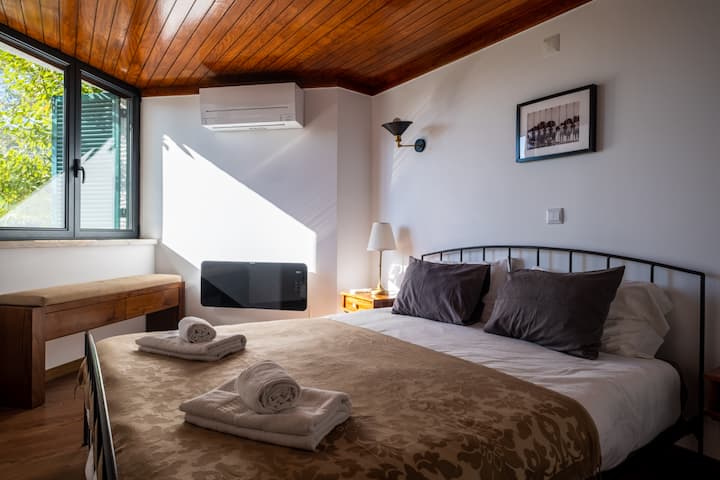 Unwind in our private en suite room with a double bed, garden views, and climate control comfort.